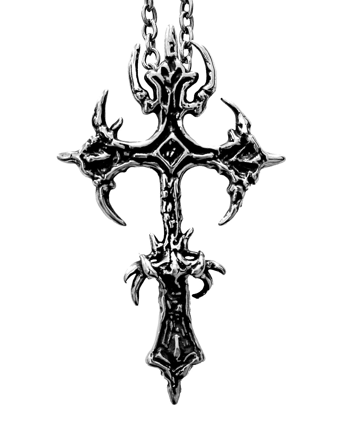 Steel cross pendant with detailed design on a white background