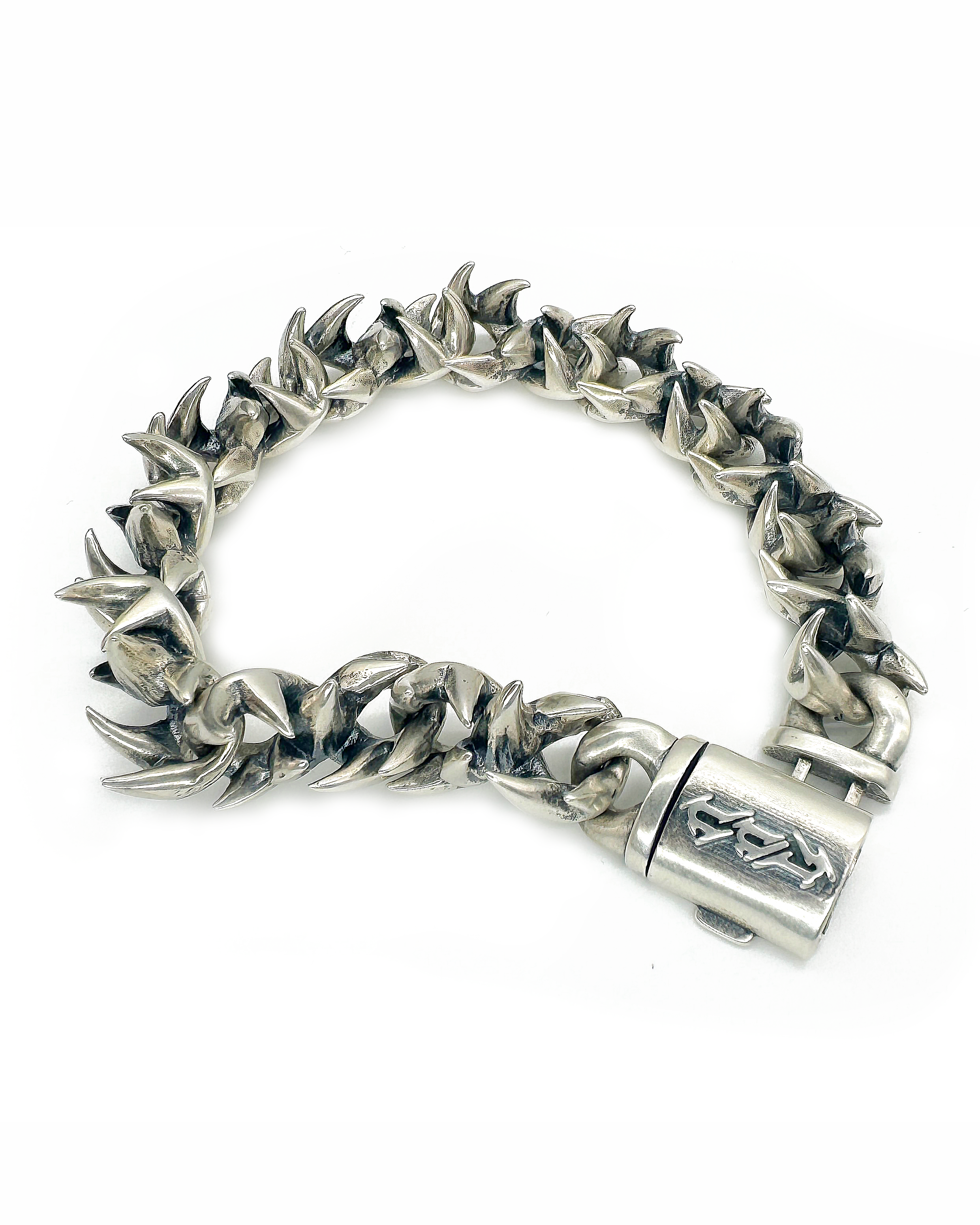 A bracelet with silver infinity links and a clasp, on a white background.