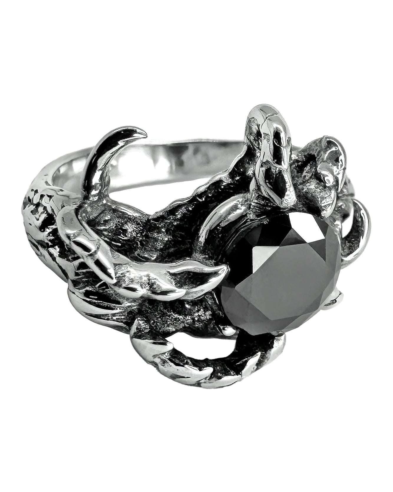A steel ring with a band designed as claw-like prongs holding a central onyx gemstone.