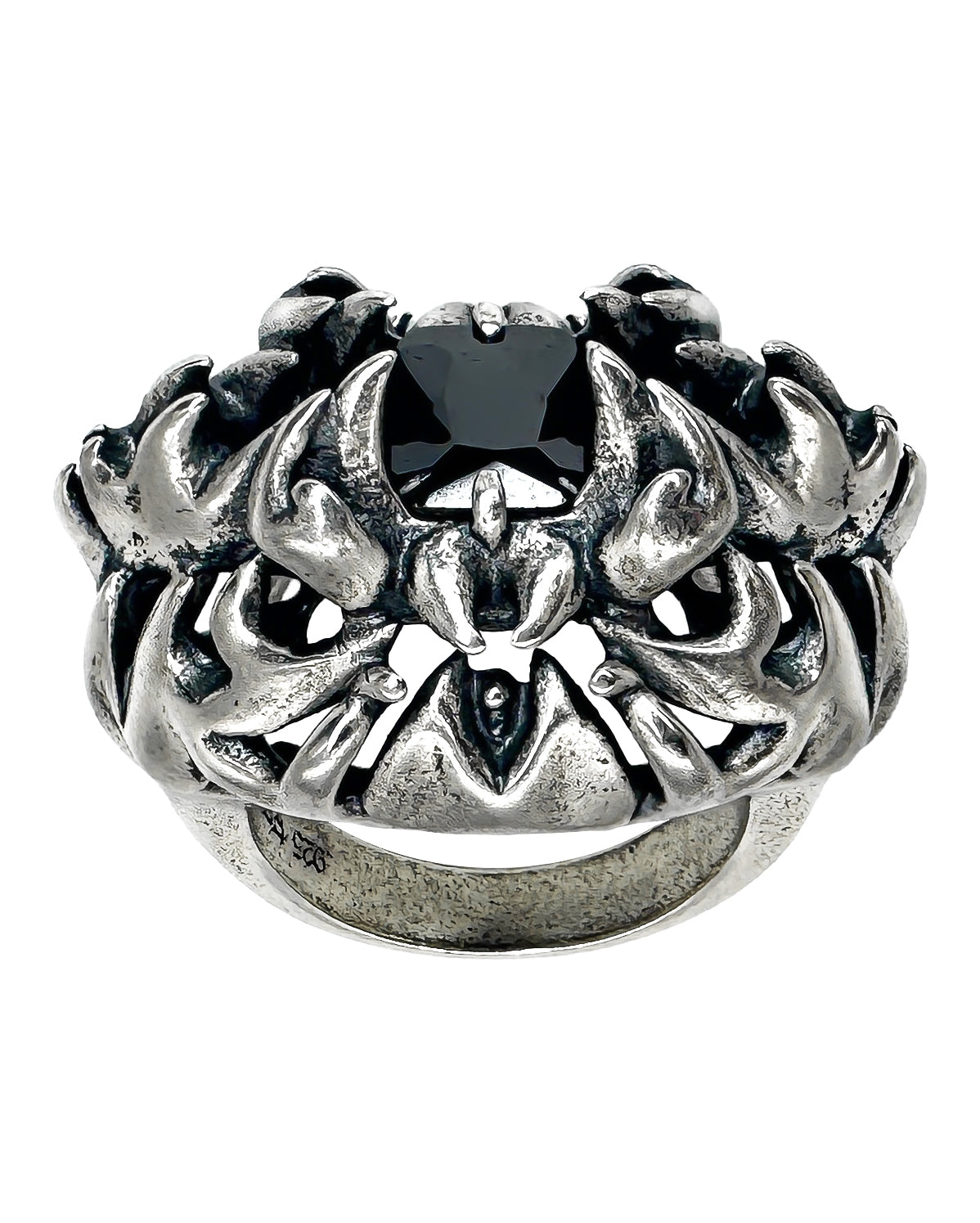 A sterling silver ring with a black gemstone and intricate engravings, designed in a gothic style.