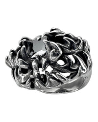 A stainless steel ring with a black gemstone and intricate engravings, designed in a gothic style.